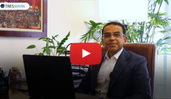 Man in office setting during Tresmark webinar.