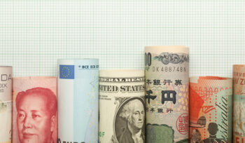 A row of money rolls labeled with the word "China" printed on each roll, showcasing currency design.